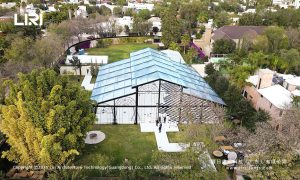 Evening wedding reception inside Pastoral Marquee - hanging greenery, romantic lighting, transparent ceiling, Mexico event