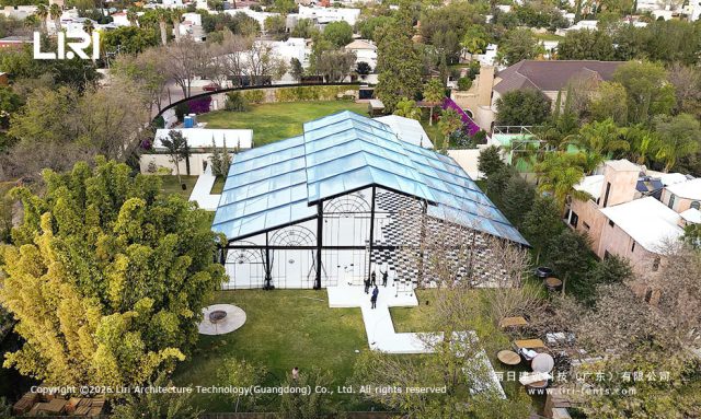Evening wedding reception inside Pastoral Marquee - hanging greenery, romantic lighting, transparent ceiling, Mexico event