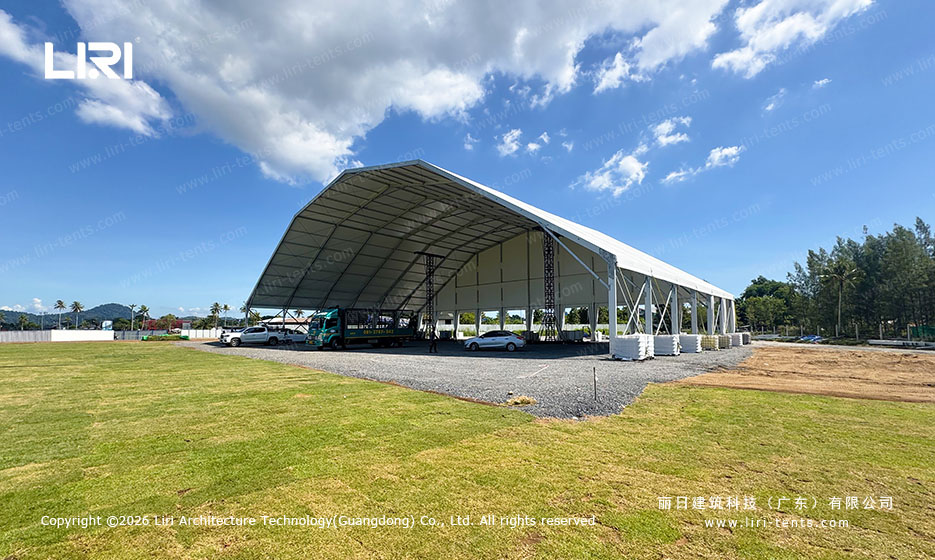 50x30m concert tent side columns with white curtains tied open for natural tropical ventilation