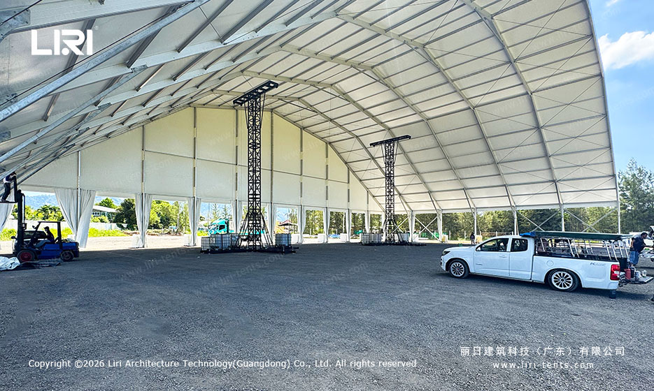 Interior of a 50x30m festival tent, lighting rigging towers, forklift operation, 10m plus clearance confirmed