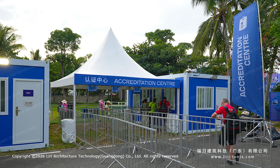Pagoda tent at the event accreditation centre with check-in counters