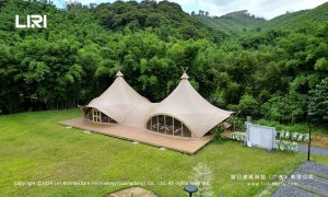 Double peak tipi tent aerial view in bamboo forest resort