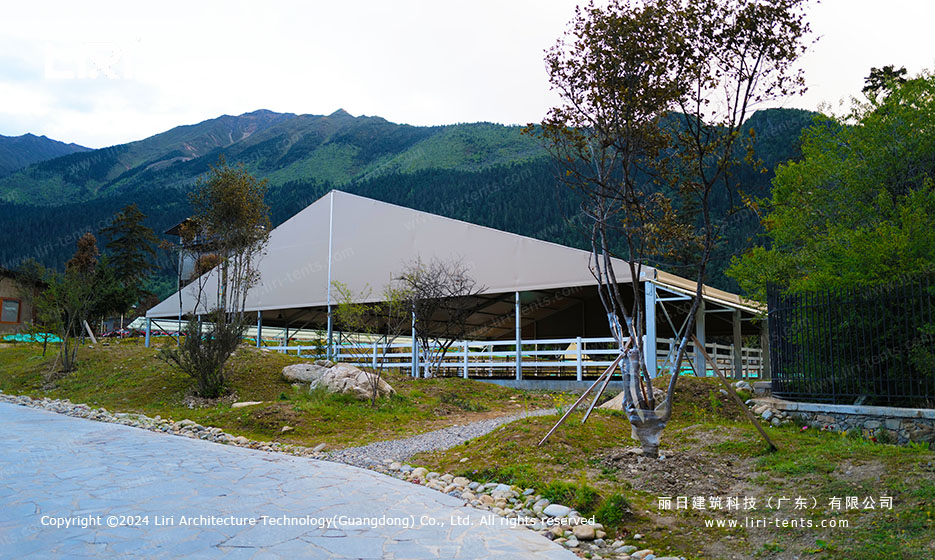 Equestrian tent mountain view from the entrance of the horse arena