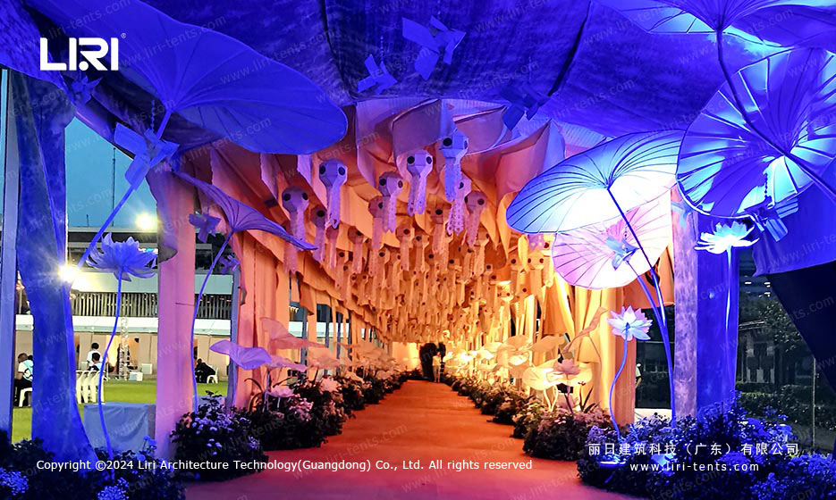 Illuminated entrance corridor inside transparent party tent