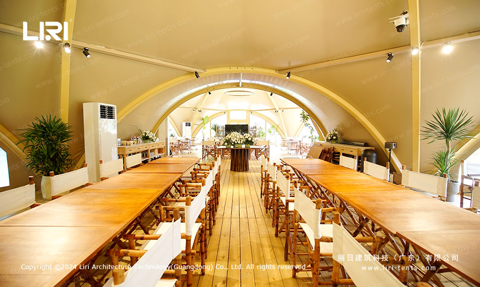 Luxury party tent long dining hall interior with warm lighting