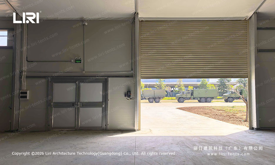 Military vehicle hangar tent interior with open access door