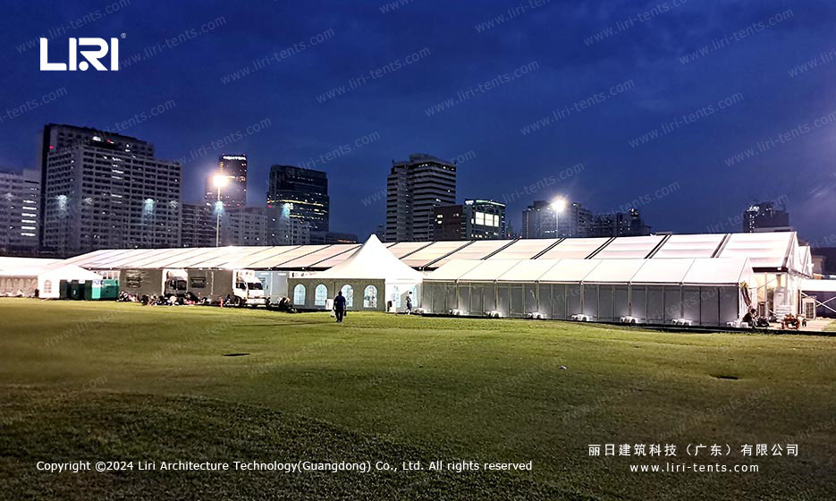 Night view of clear span party tent complex in city