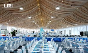 Party tent banquet hall interior with table settings