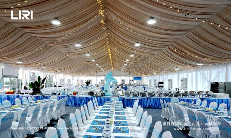 Party tent banquet hall interior with table settings