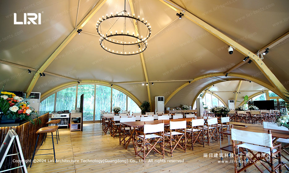 Party tent interior with chandelier and dining setup for events