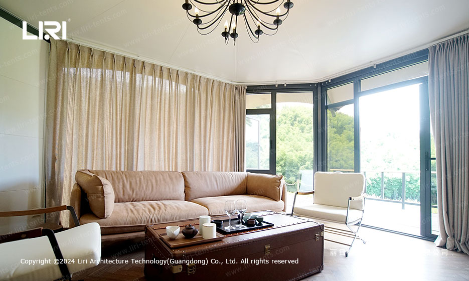 Party tent living room interior with large windows and elegant chandelier
