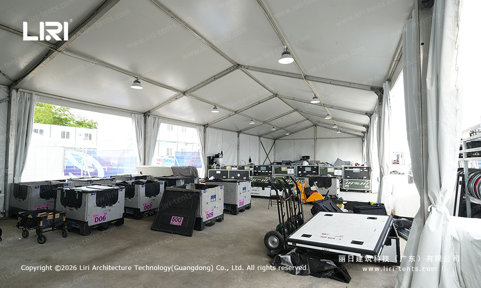 Race-day equipment staging and circuit cases inside the support tent