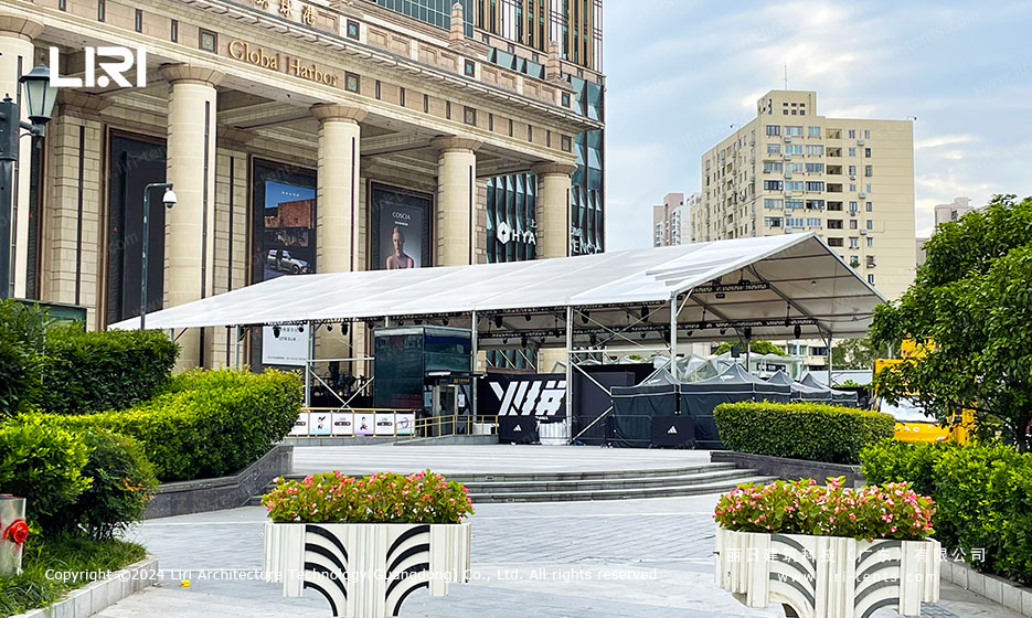 White PVC clear span event tent set up outside a commercial plaza in Shanghai for a basketball activation
