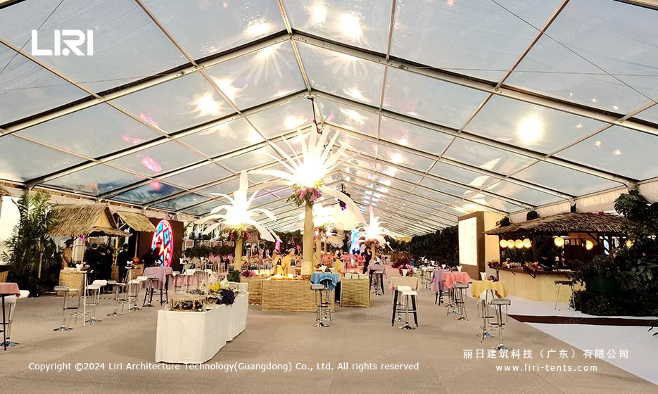 Tropical catering stations under clear roof party tent