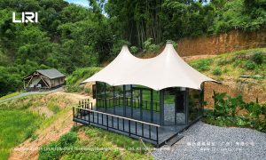 Twin tipi tensile membrane structure with glass wall panels