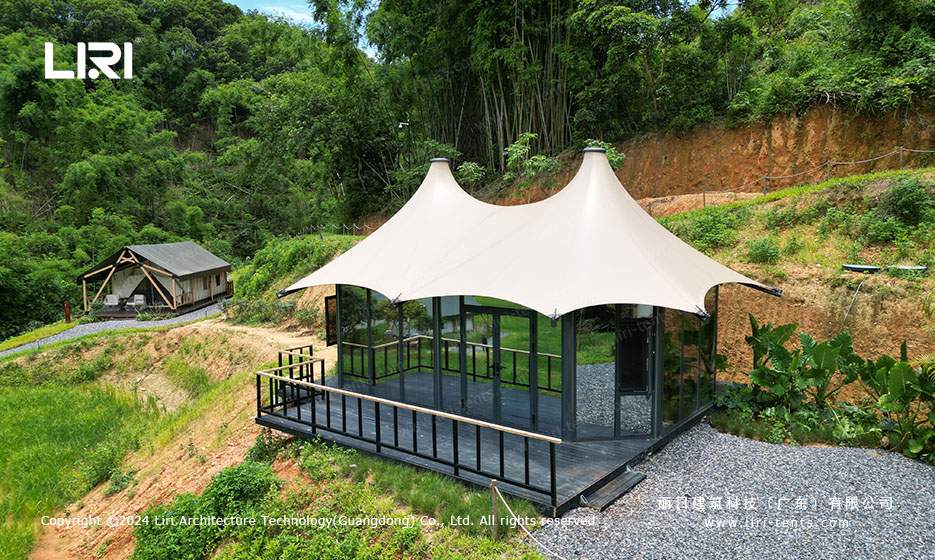 Twin tipi tensile membrane structure with glass wall panels