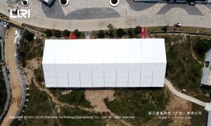15x30m white aluminium party tent aerial view at coastal restaurant