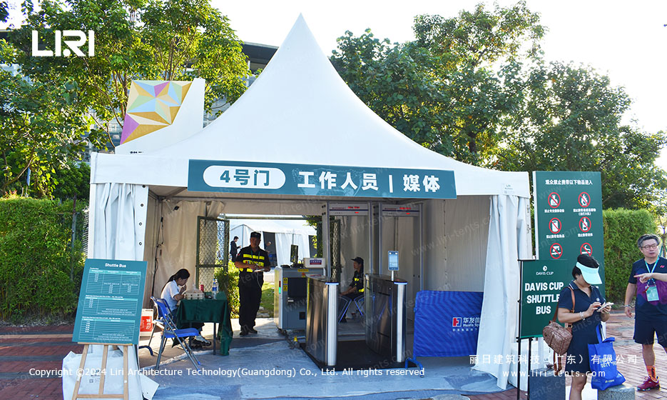 white pagoda tent at Gate 4 staff and media entrance of a tennis tournament