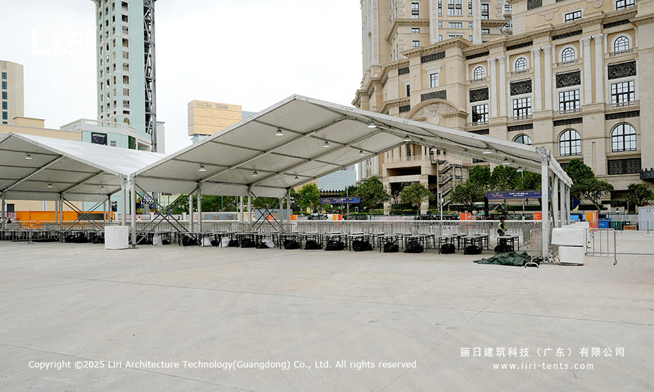 Award ceremony party tent set up on a coastal urban plaza with a clear span A-frame roof and white PVC fabric