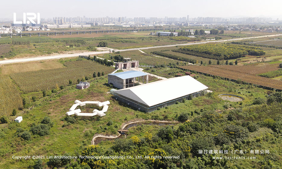 aerial view of outdoor wedding tent site with surrounding grounds