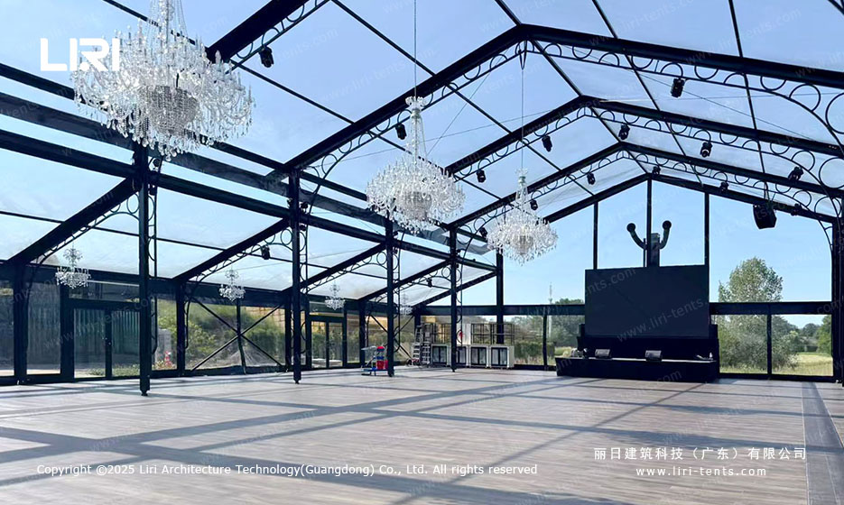 crystal chandeliers hanging from aluminum orangery glass ceiling