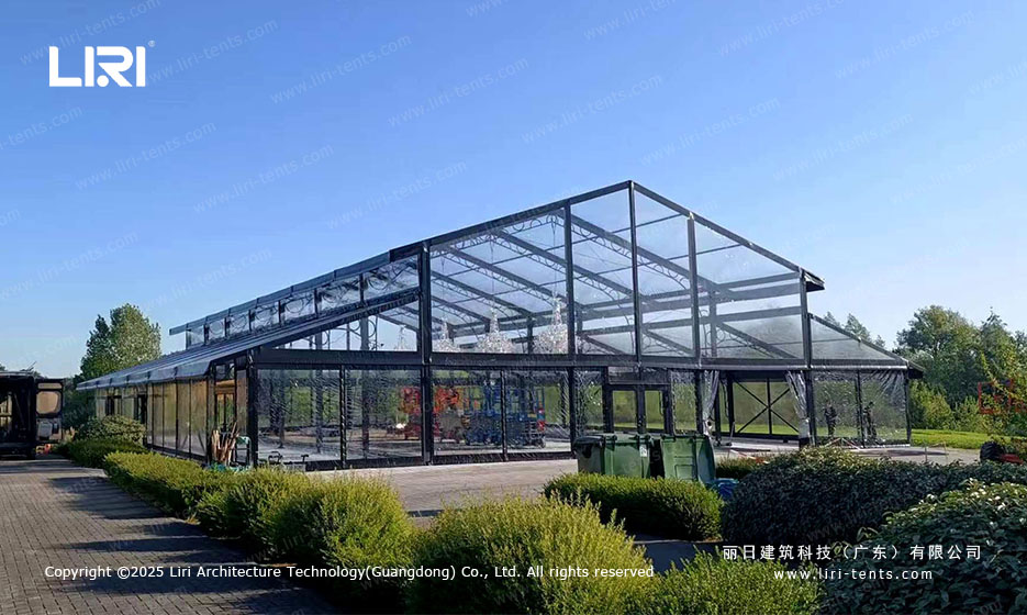 aluminum orangery front entrance with hedge-lined path