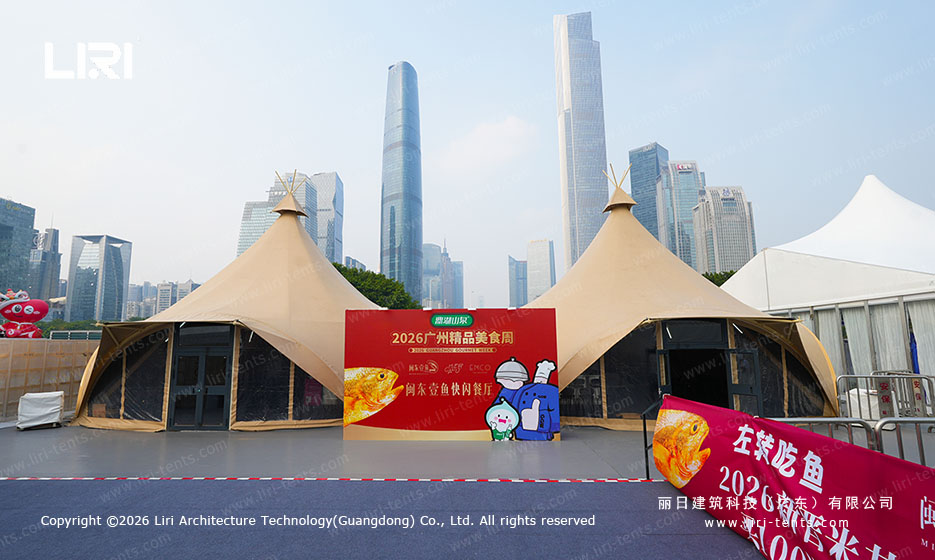 High peak tent bays with a food service counter and event lighting